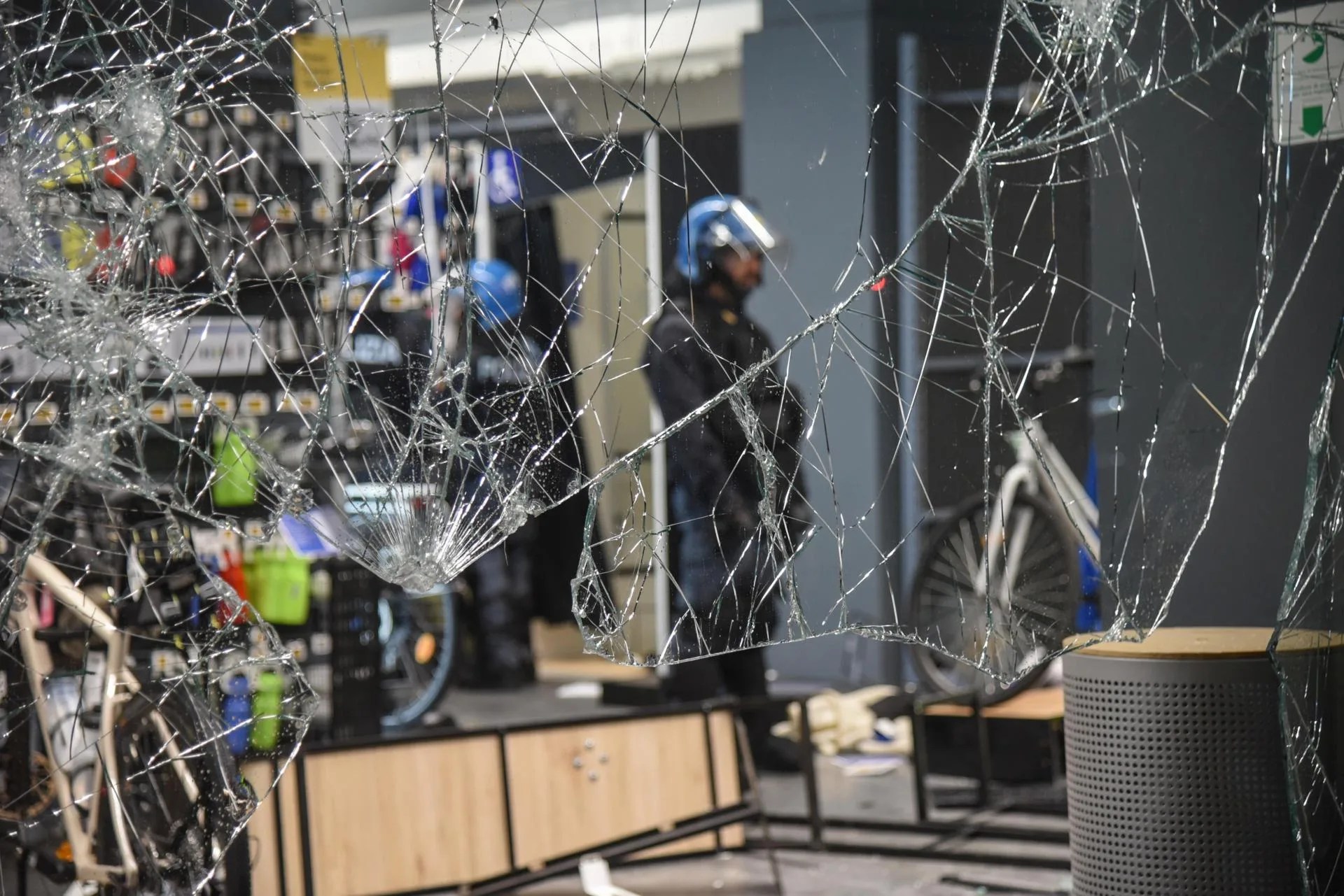 A store with shattered windows and debris scattered across its entrance following unrest in central Milan, Italy, 18 October 2026. EFE/EPA/MATTEO CORNER