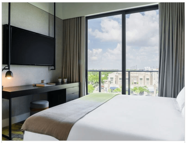 bed beside big window