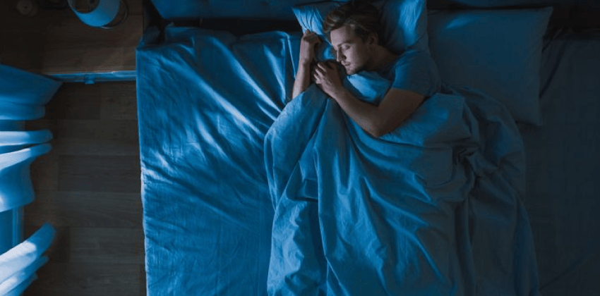 Man sleeping in bed