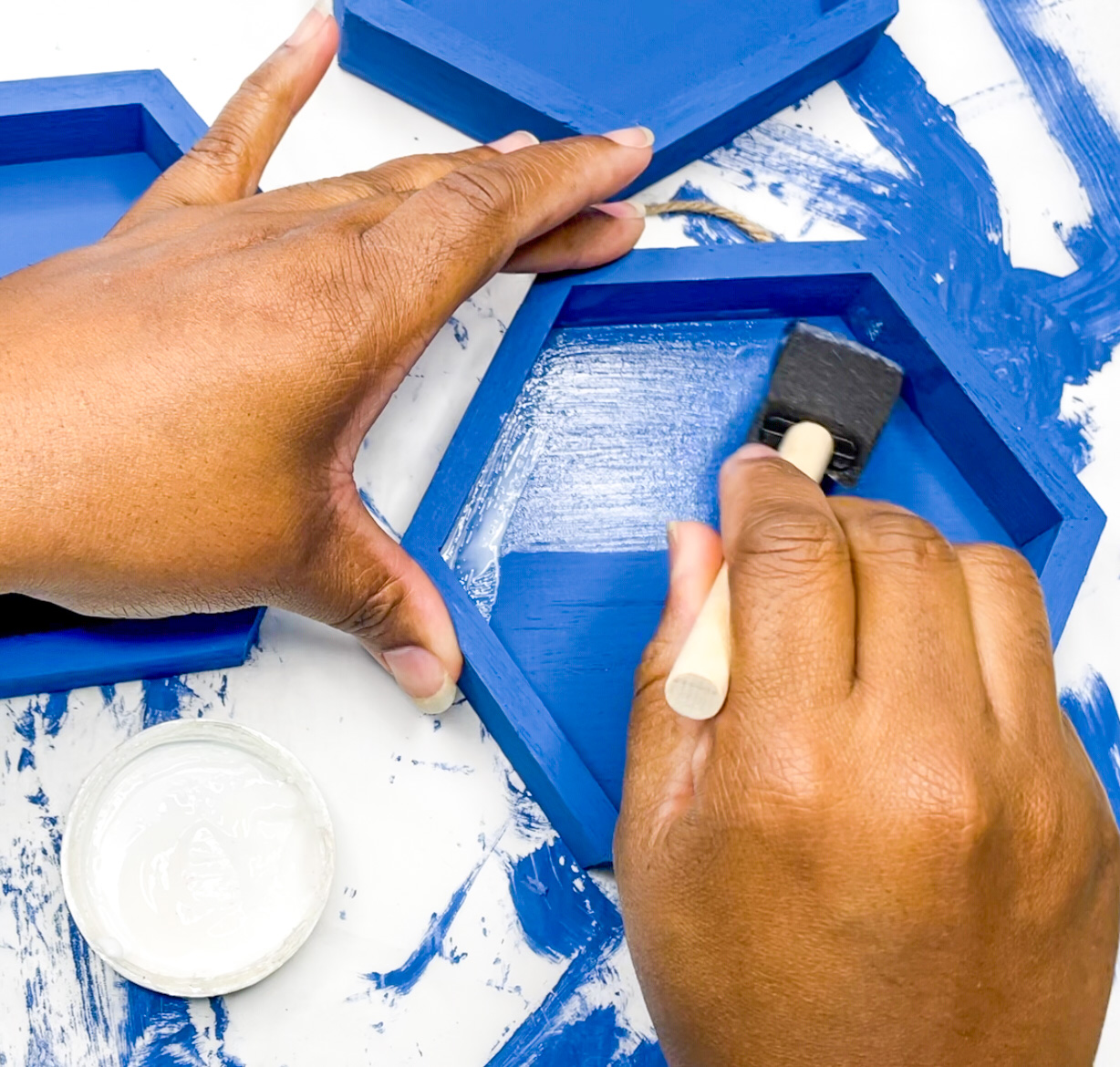 adding mod podge to painted hexagons