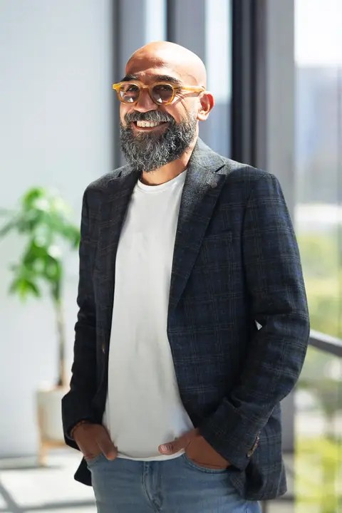 Professional portrait of Wessam Khalifa in a modern office