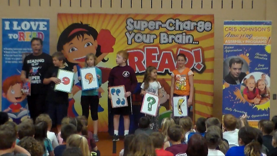 picture of primary elementary and middle read across america parp reading school assembly performer Cris Johnson