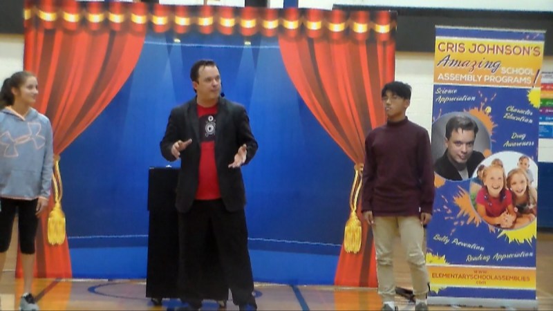 Middle school students reacting during a Cris Johnson assembly program