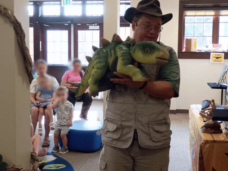 Cris Johnson performing Jurassic Journeys at a school or library