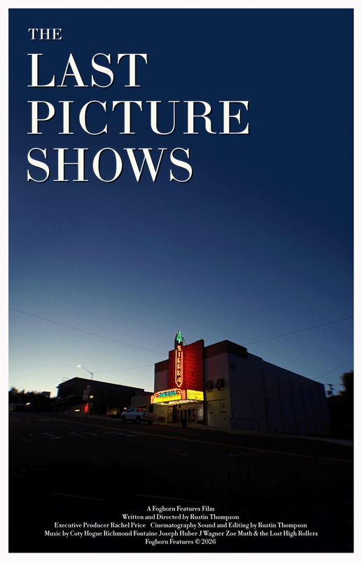 A theater with a neon sign reading "SIERRA" at dusk, beneath a deep blue sky.