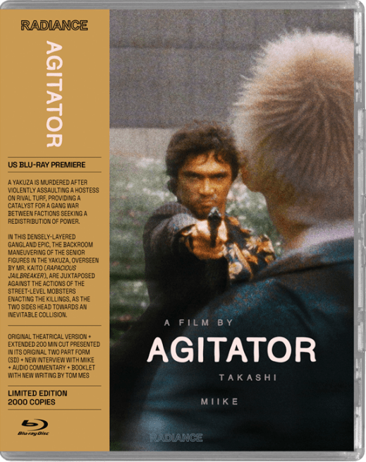 Blu-ray cover of the film "Agitator" by Takashi Miike, featuring a tense standoff image and detailed text about the film.