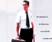 Cover of the film "Falling Down," featuring a man in a white shirt and black tie holding a briefcase, with a blurred cityscape behind him and text describing the film.