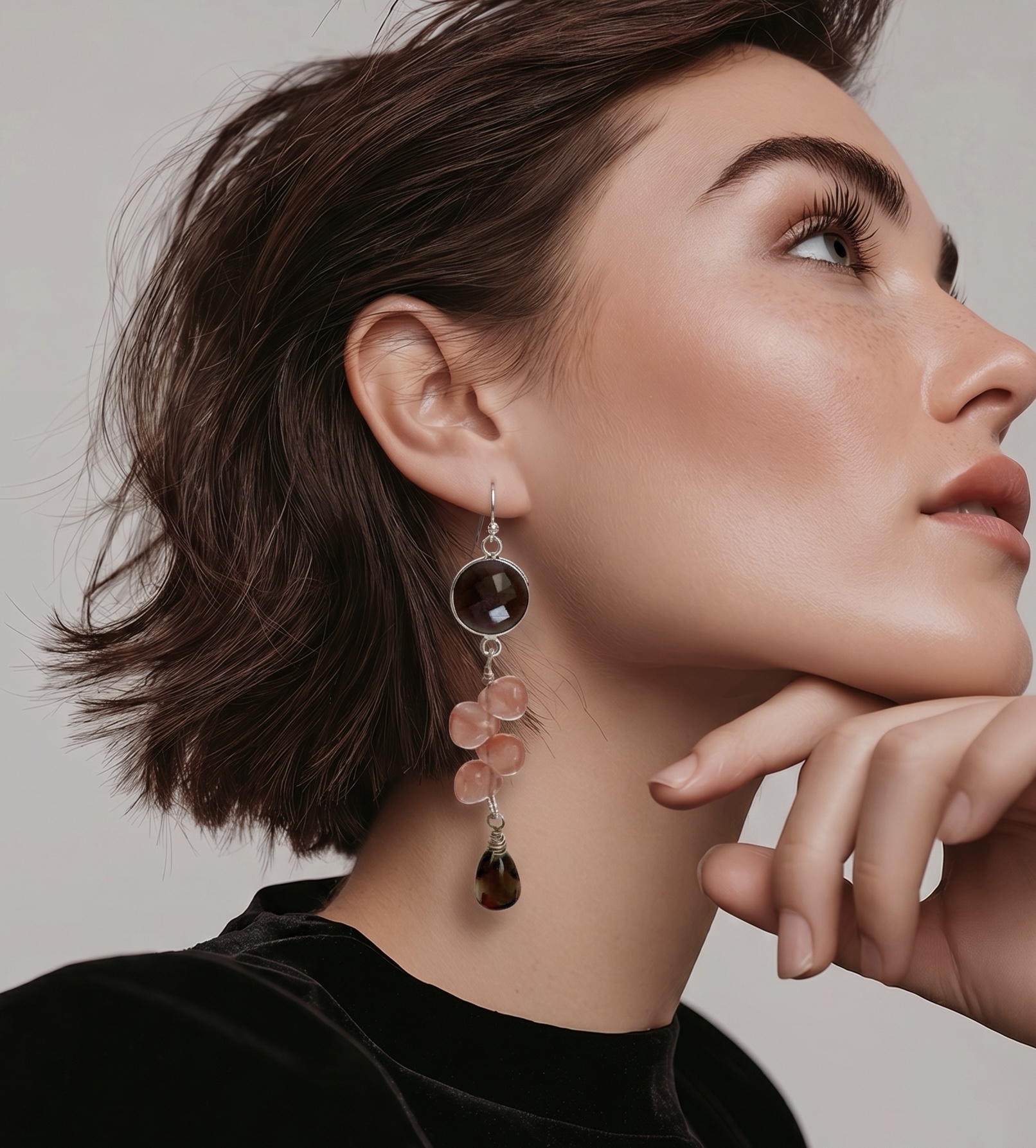 These brown and pink gemstone sterling earrings remind me of wild berries. A branch of smooth teardrop shaped watermelon quartz is suspended from a round faceted chocolate moonstone. The little drop of natural smoky quartz dangles from a branch. Finished with sterling silver French wire closure.