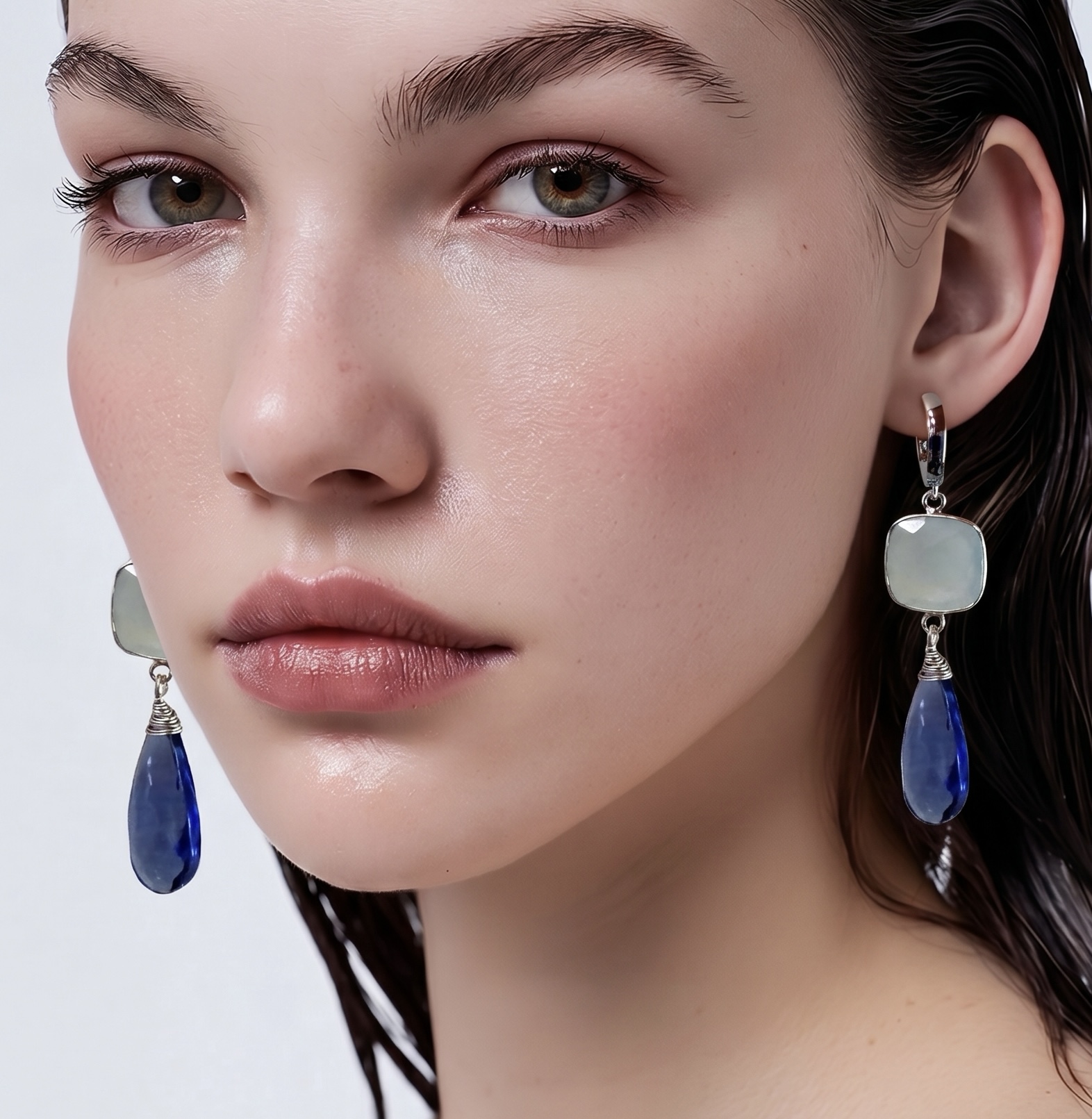 Smoky quartz stones are nicely complimented with faceted ice-blue chalcedony squares set in a silver bezel. Suspended from an antiallergenic platinum-plated latch back hoop with a hinge (nickel & lead-free). Earrings length: 2.25” (60mm)
