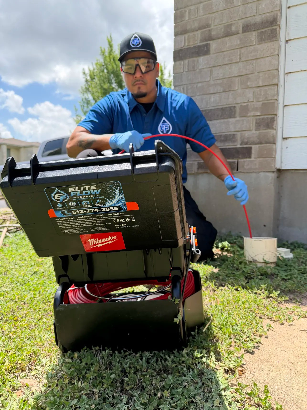 Elite Flow Services plumber performing a sewer camera inspection and drain cleaning at an Austin home