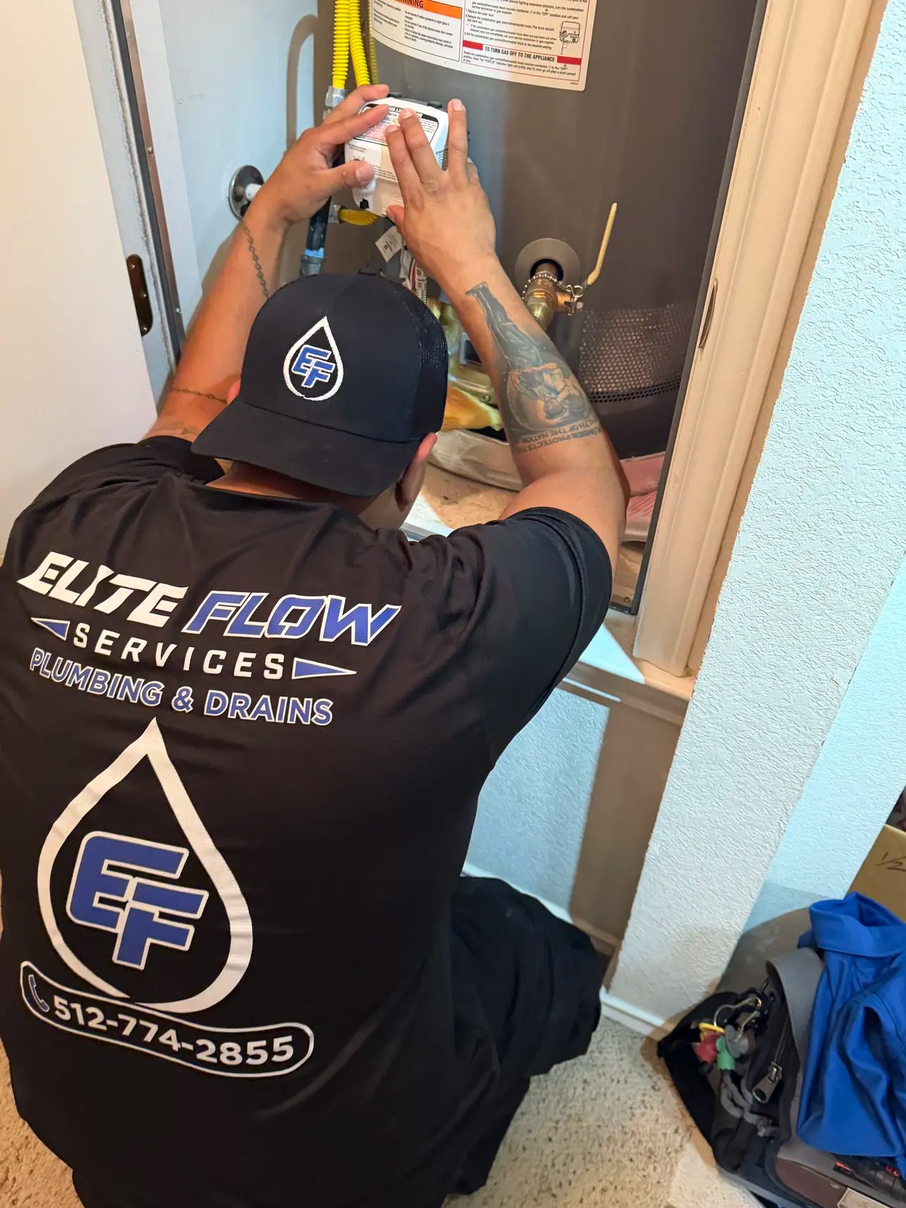 Elite Flow Services technician performing a gas water heater installation in Austin