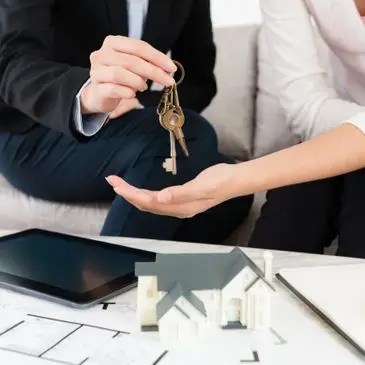 Buyer receiving the keys to a new home with trusted Santa Monica real estate broker Elizabeth Sorgen.
