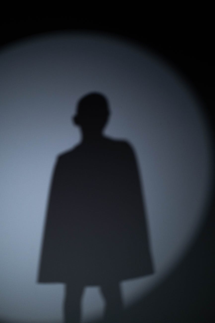 shadow of a person on gray wall
