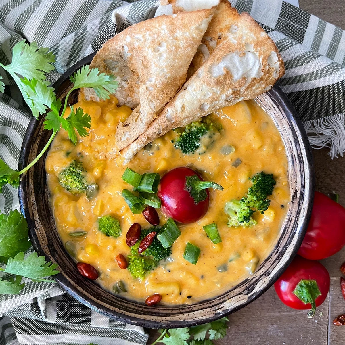 Creamy broccoli corn chowder with potatoes, sweet corn, green onions and sunflower seeds in a rich golden broth.