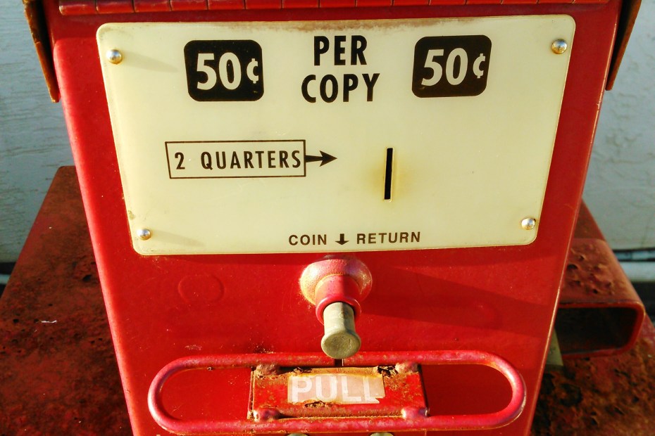 Red newspaper vending machine