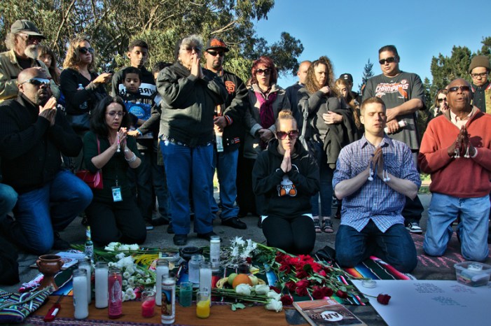A Buddhist prayer takes place during the vigil for Alejandro Nieto, who was a Buddhist, at Bernal Heights, Monday March 24. Photo Shane Menez