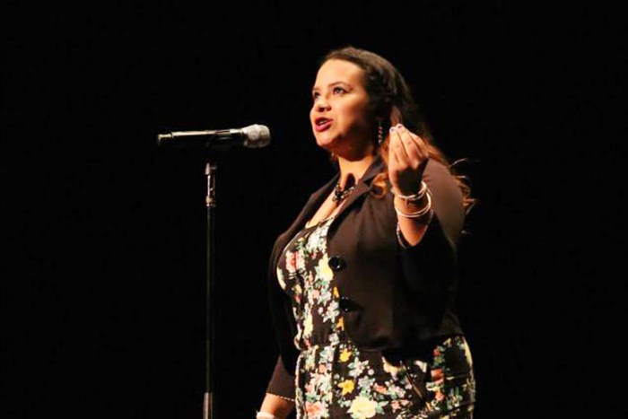 Brenda Quintanilla, the youngest Poet Laureate in Richmond, performs at San Francisco’s Nourse Theater during the Youth Speaks Teen Poetry Slam, an Olympic-style poetry competition open to Bay Area youth, on March 21. Photo for Youth Speaks by Bethanie Hines