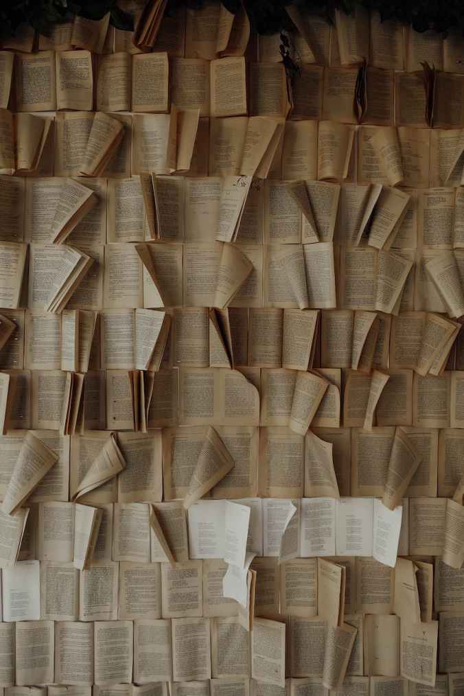 a bunch of open books in rows