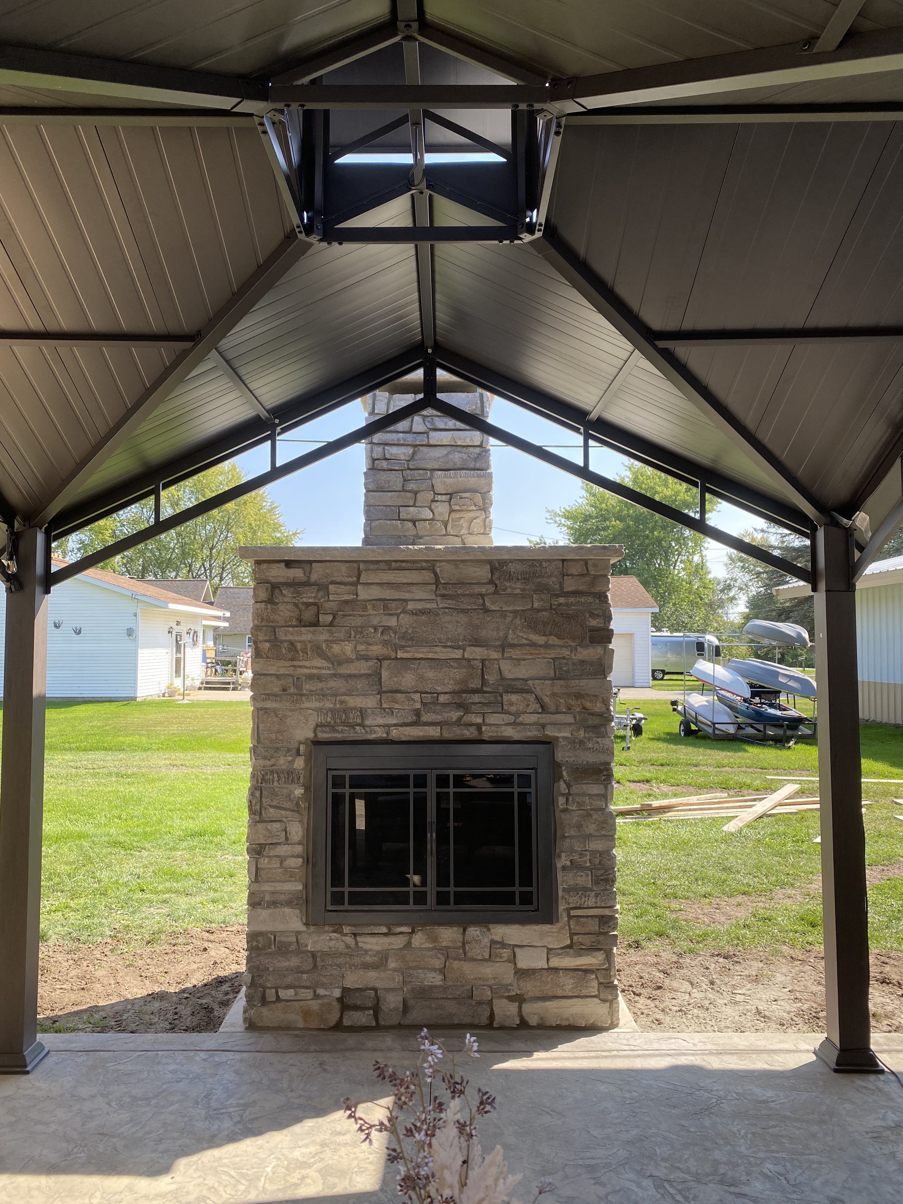 This is a prefabricated outdoor fireplace. It consists of a steel frame and masonry exterior. The fireplace is compatible with pallet forks allowing it to be transported and installed with ease. This is a wood fired fireplace. The exterior is fully customizable. Custom fireplace can also be placed.