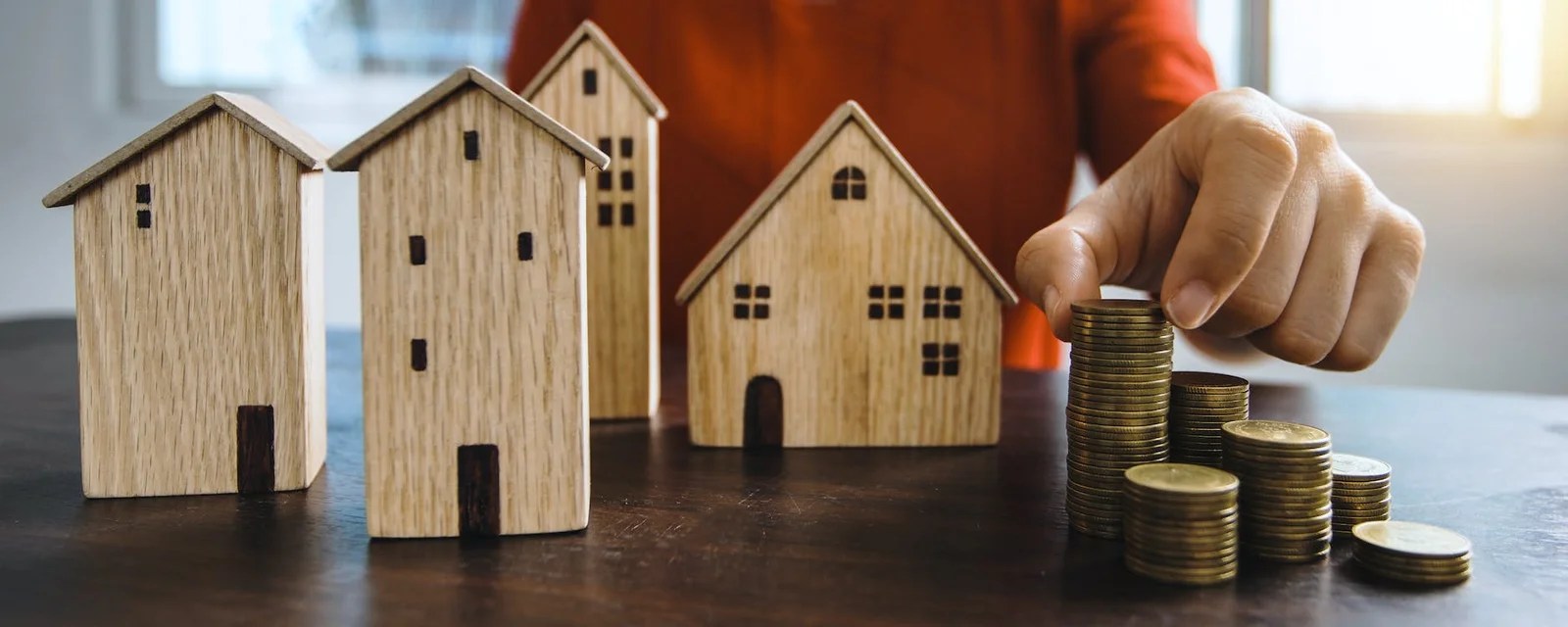 brown wooden miniature house on brown wooden table