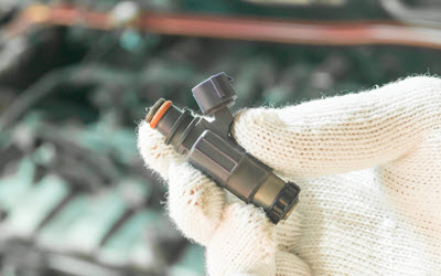 What happens if you drive bmw with a clogged fuel injector?