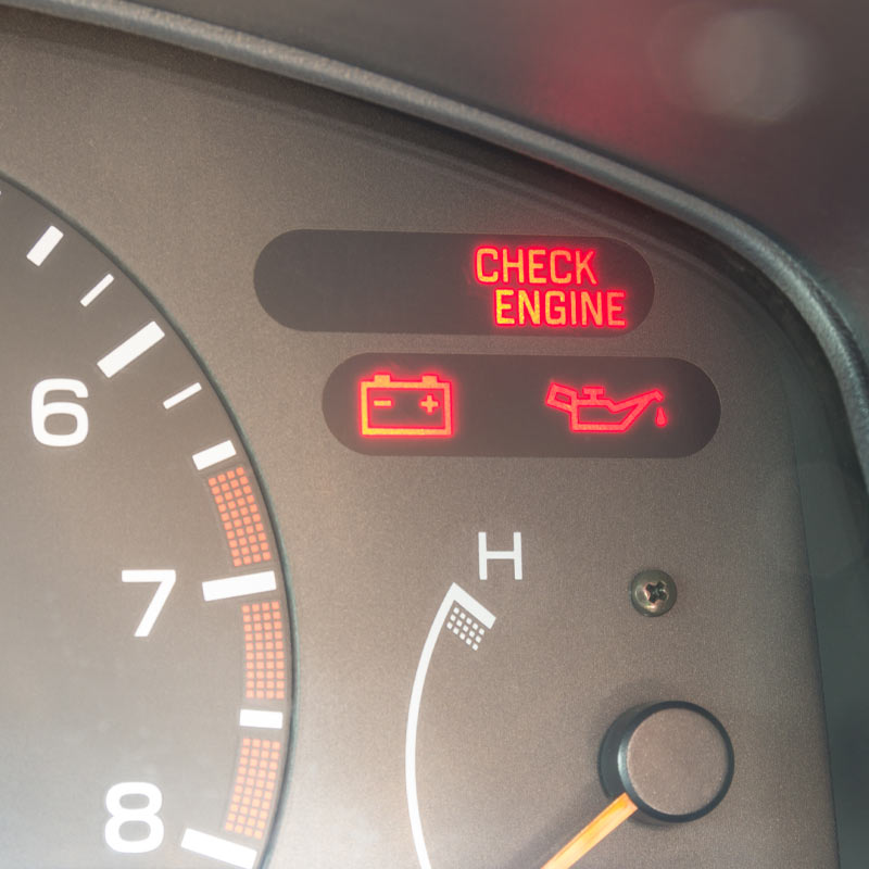 Car gauges showing warnings