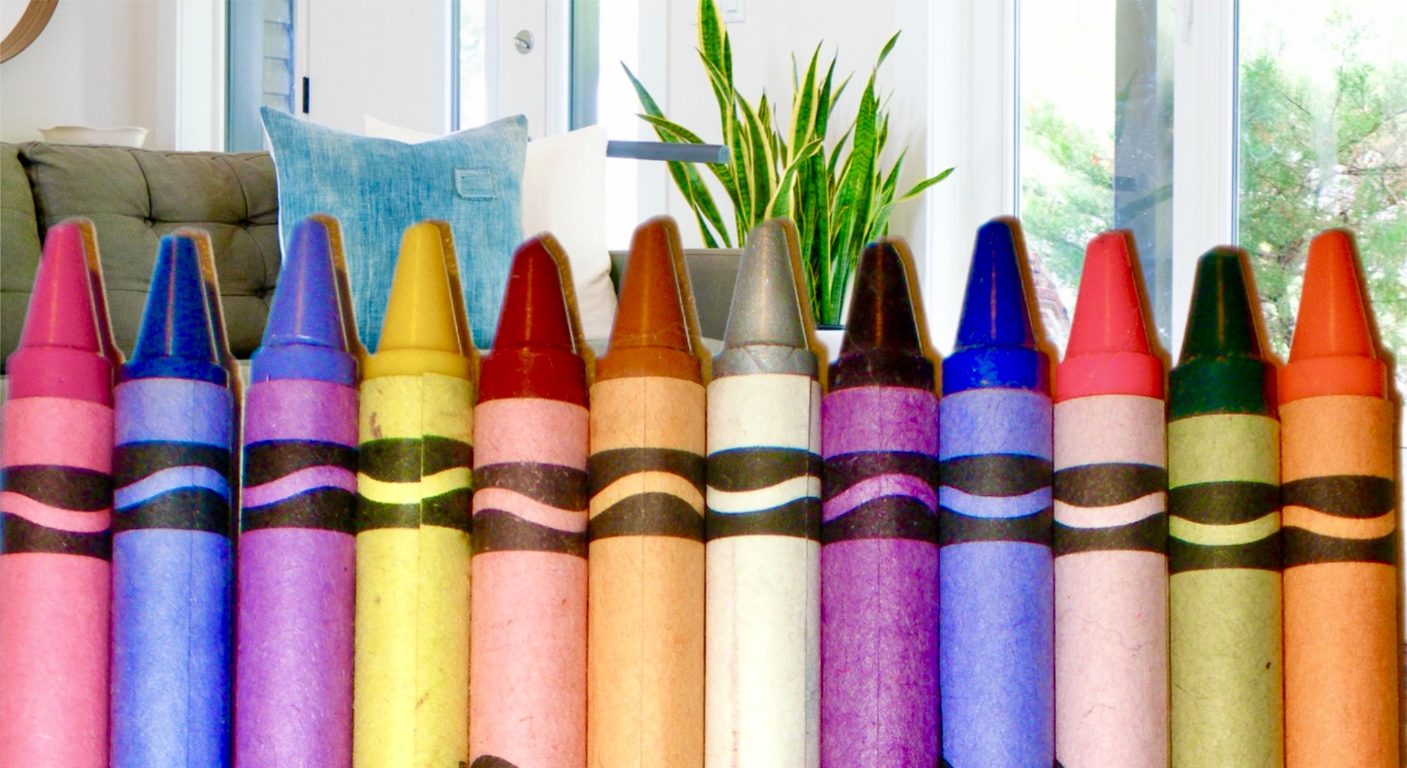 Crayons against a living room background