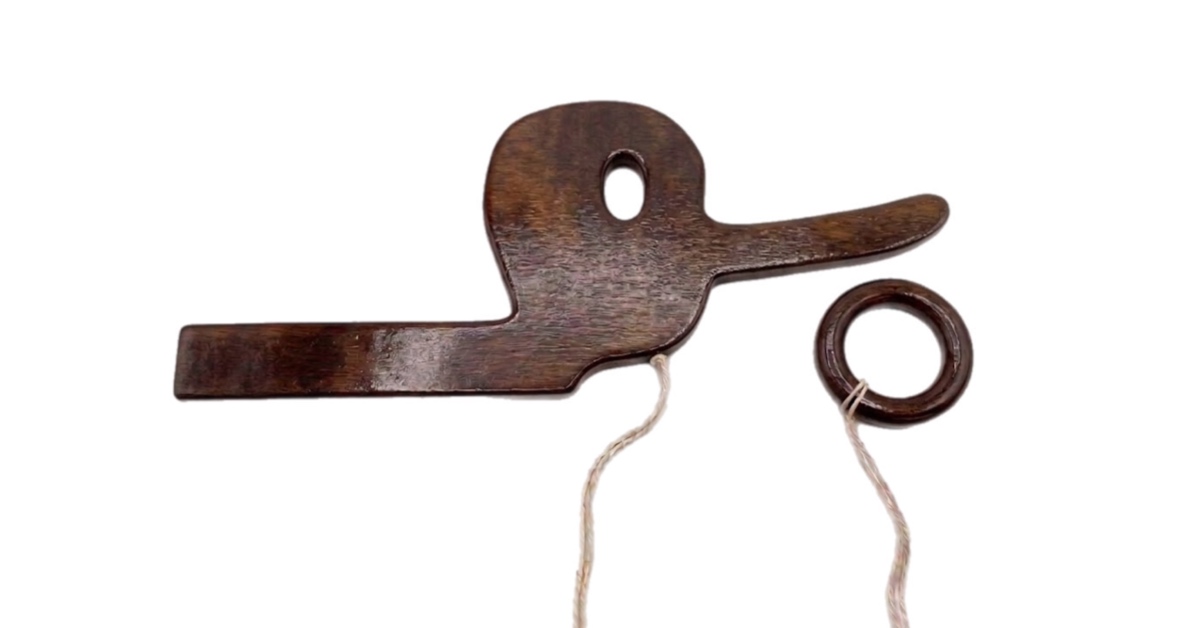 Long-nosed wooden ring toss toy