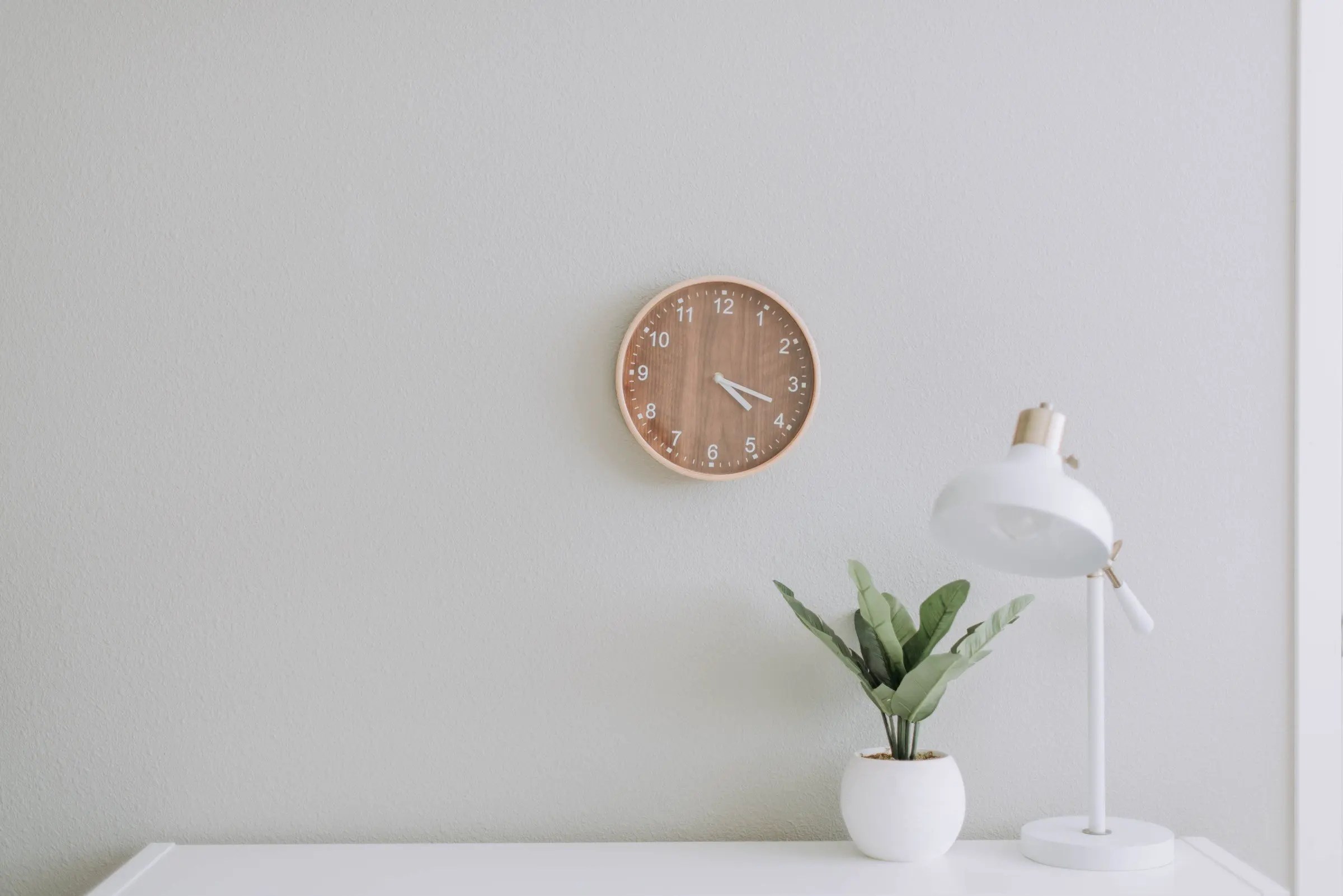 Overtaken by time symbolised by a wall clock above a desk s