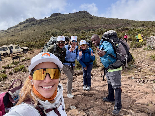 A group of people climbing Mount Kilimanjaro