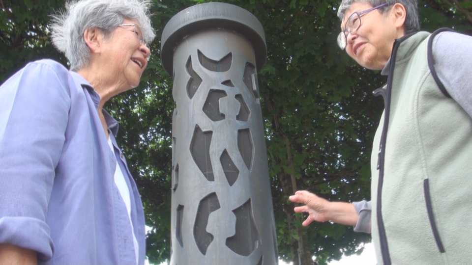 Committee members Alice Tanaka Hikido and Mary Tanaka Abo viewing George Tsutakawa's memorial sculpture entitled "Harmony". It is located near the entrance of Puyallup's Western Washington Fair Grounds. Alice and Mary were evacuated to the Puyallup Assembly Center, temporarily called Camp Harmony, in 1942 before being transported to Minidoka Internment Camp in Idaho where they were held for three years.