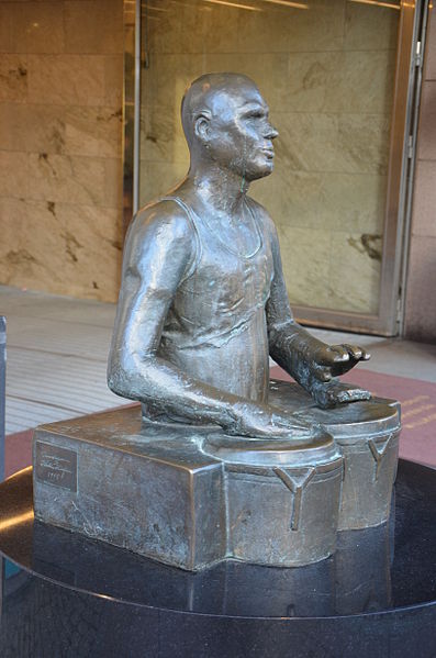 Trumslagaren by Hertha Hillfon, bronze, 1995, in front of PUB, Hötorget, Stockholm