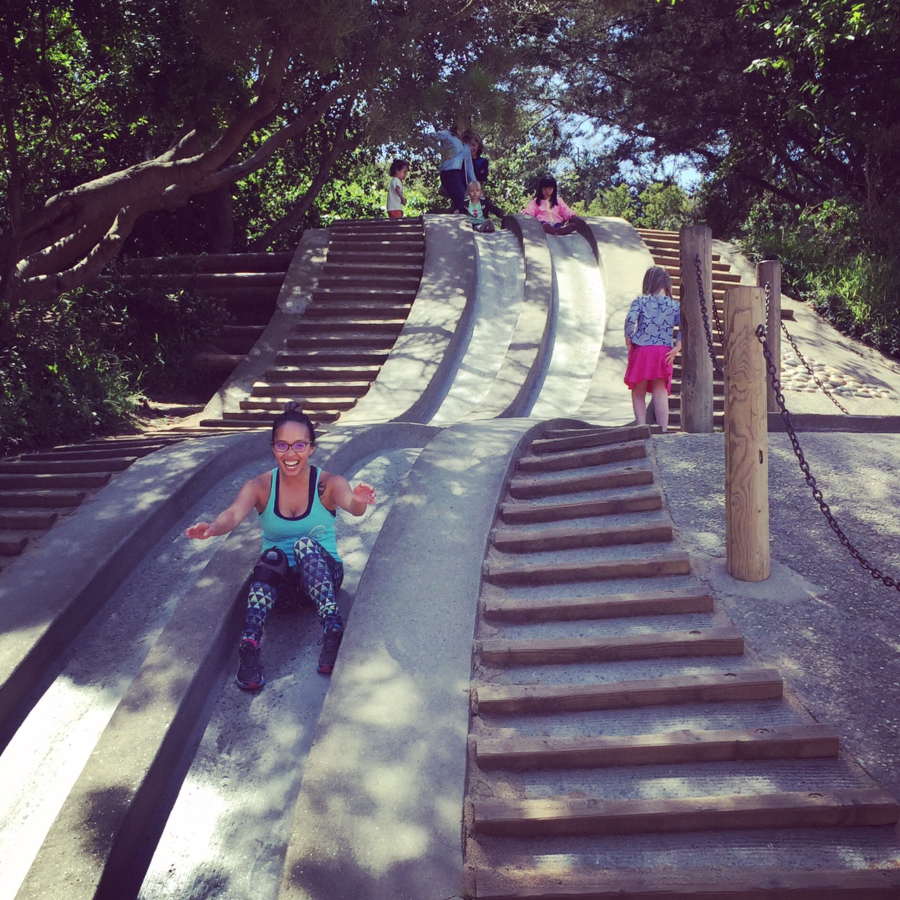 Ms. T sliding down the cardboard slide.