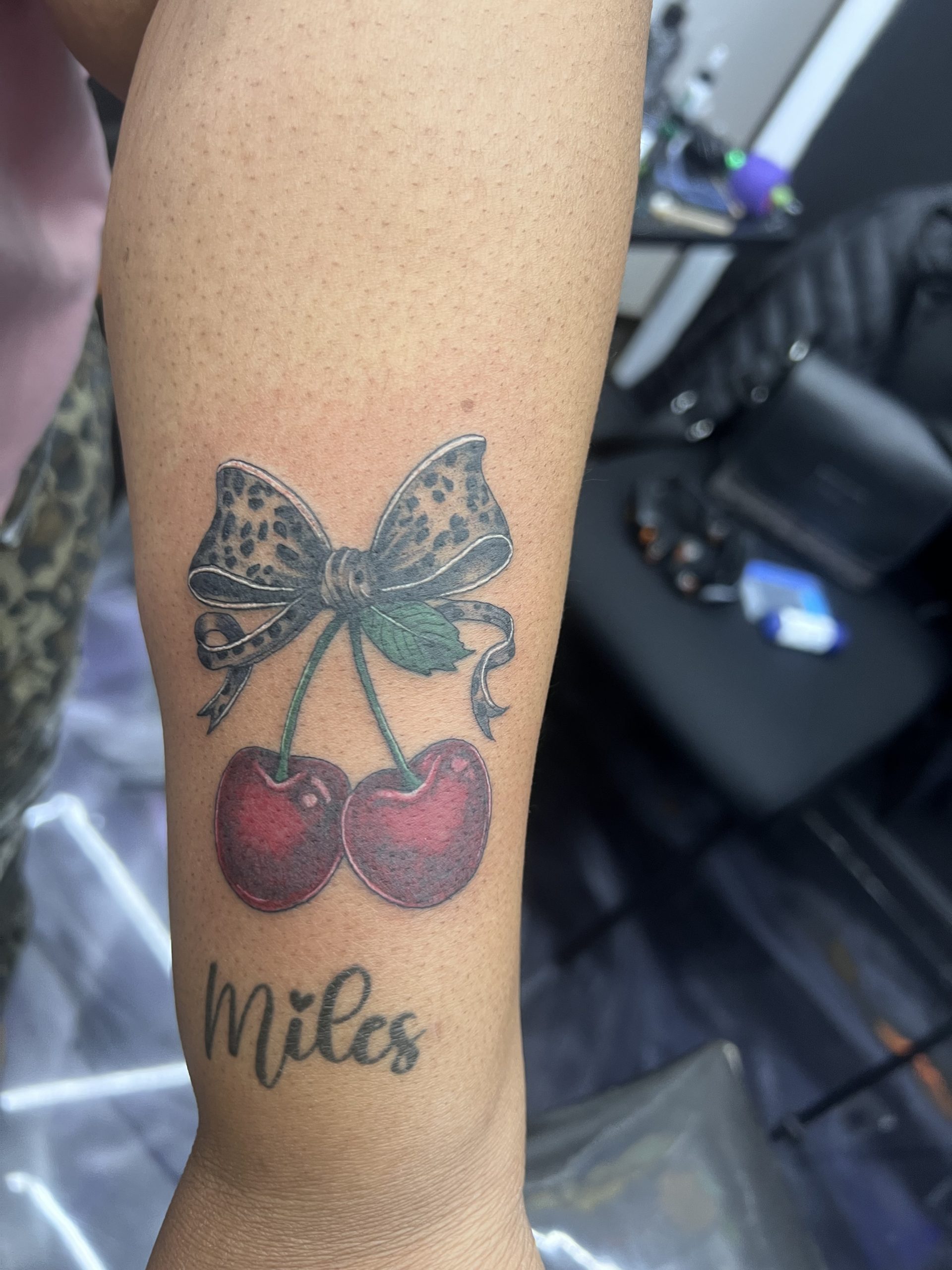 Cherries with Cheetah Print bow tattoo by Janell at EQ in West Deptford, NJ
