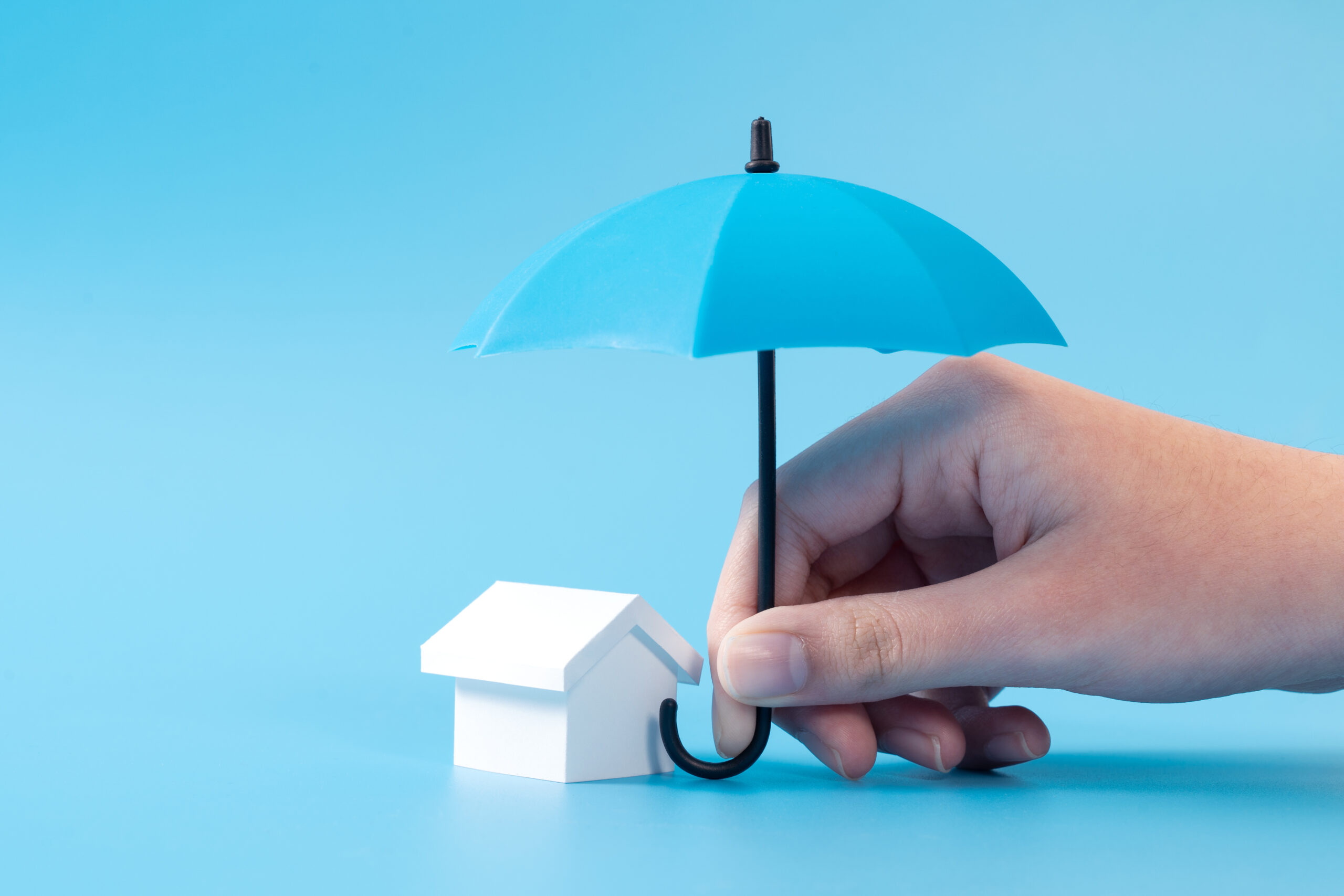 House model under blue color umbrella