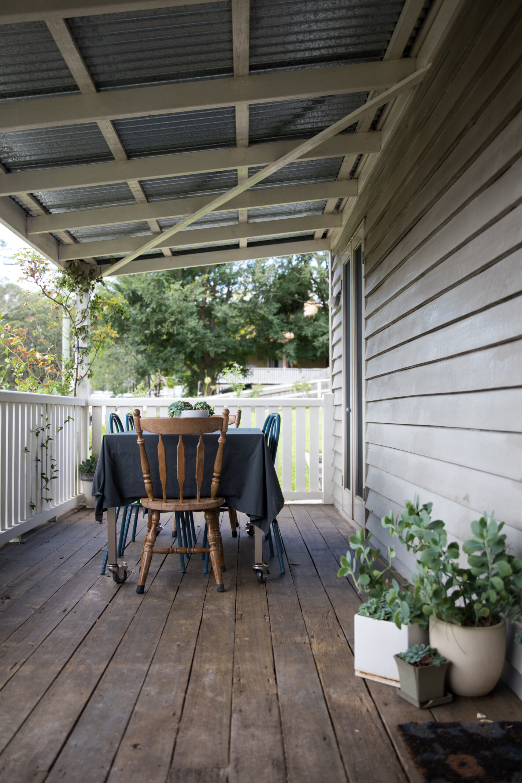Outdoor seating and dining on vintage rustic cottage home