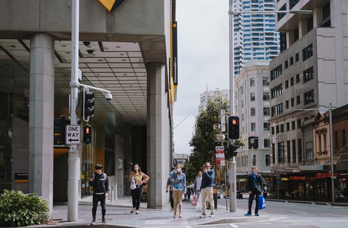 People standing on traffic lights