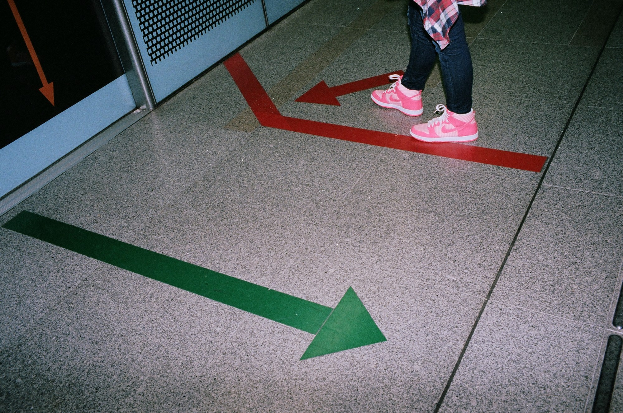 Pink nike shoes, red and green arrows. Singapore, 2013