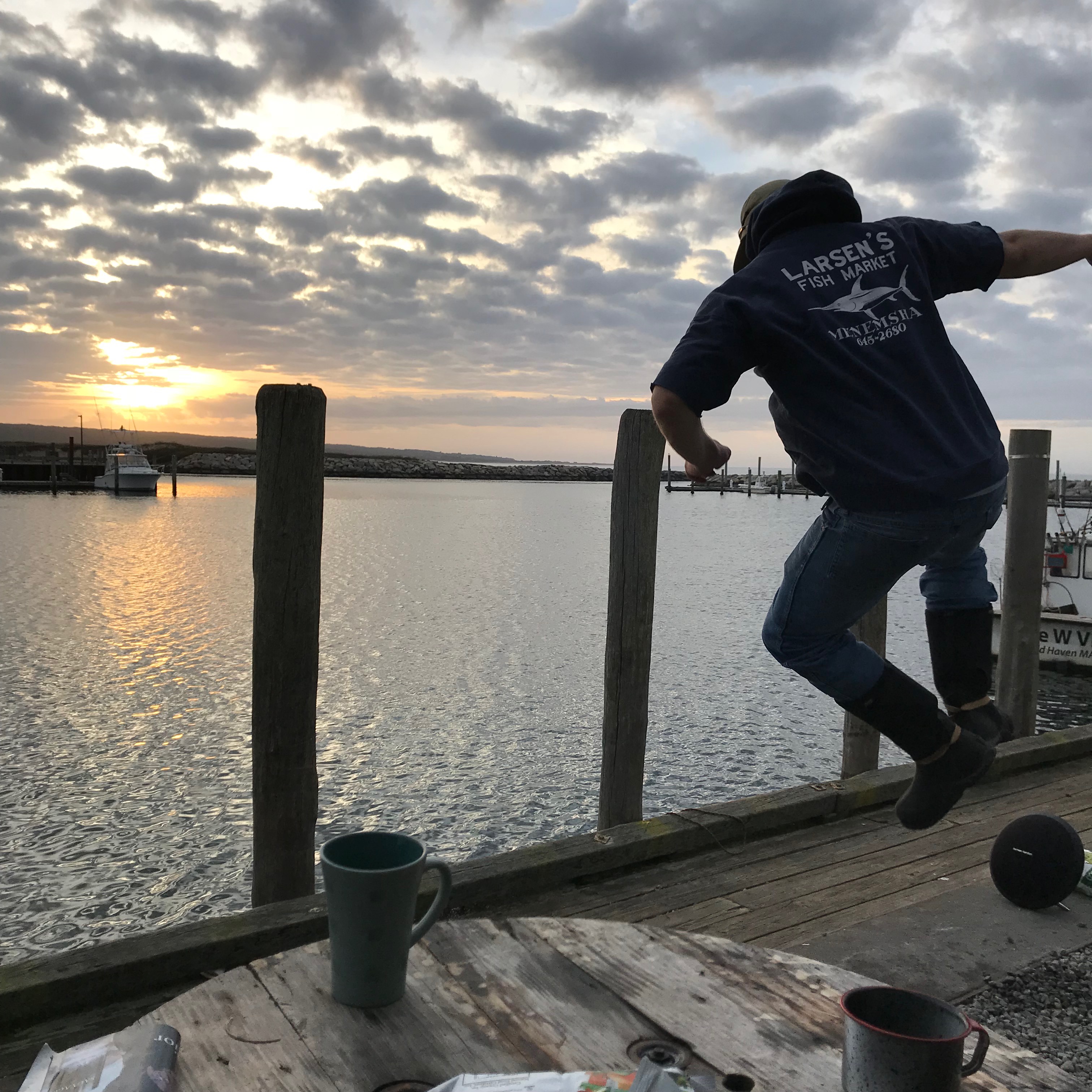 Cleaned up and partying as the sun sinks into the ocean on closing day.