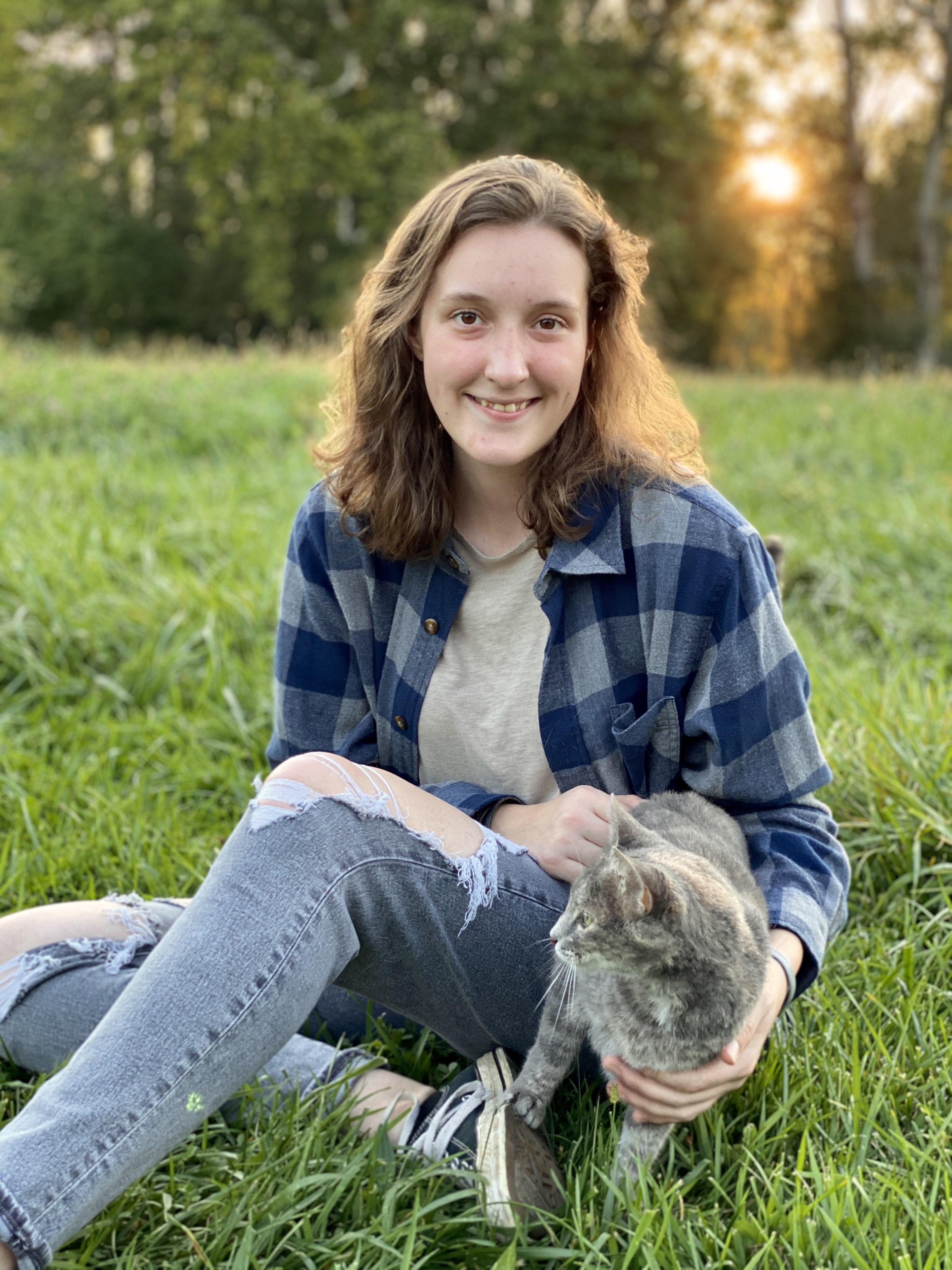 Corwyn meeting her cat in a field