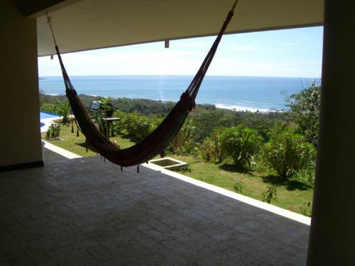 Relax on the covered patios with stunning views of the Pacific Ocean beyond