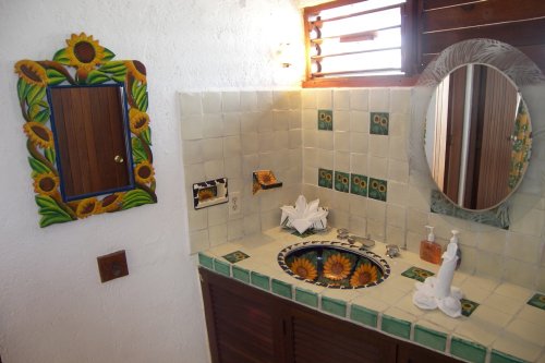 The bathrooms of this luxurious home on the Maya Riviera are beautiful