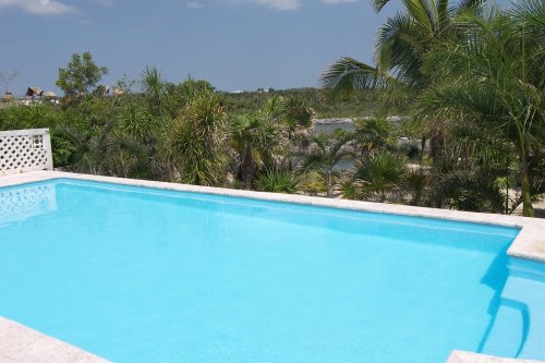 This vacation villa has a huge pool near the lagoon