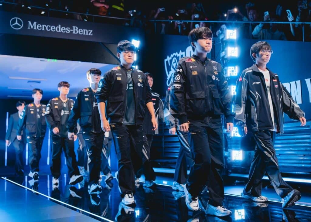 The image shows the T1 esports team taking the stage during one of the international League of Legends tournaments