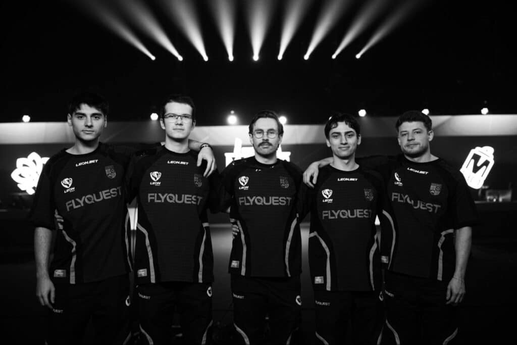The FlyQuest CS2 team posing together on stage during the Budapest Major