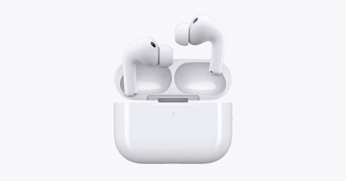 Apple AirPods Pro earbuds rest inside their open charging case against a plain white background.