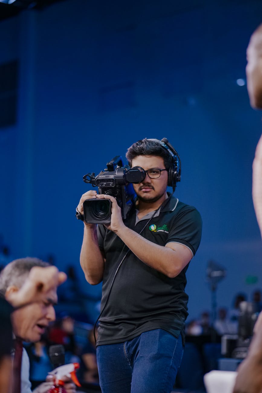 cameraman filming with camera