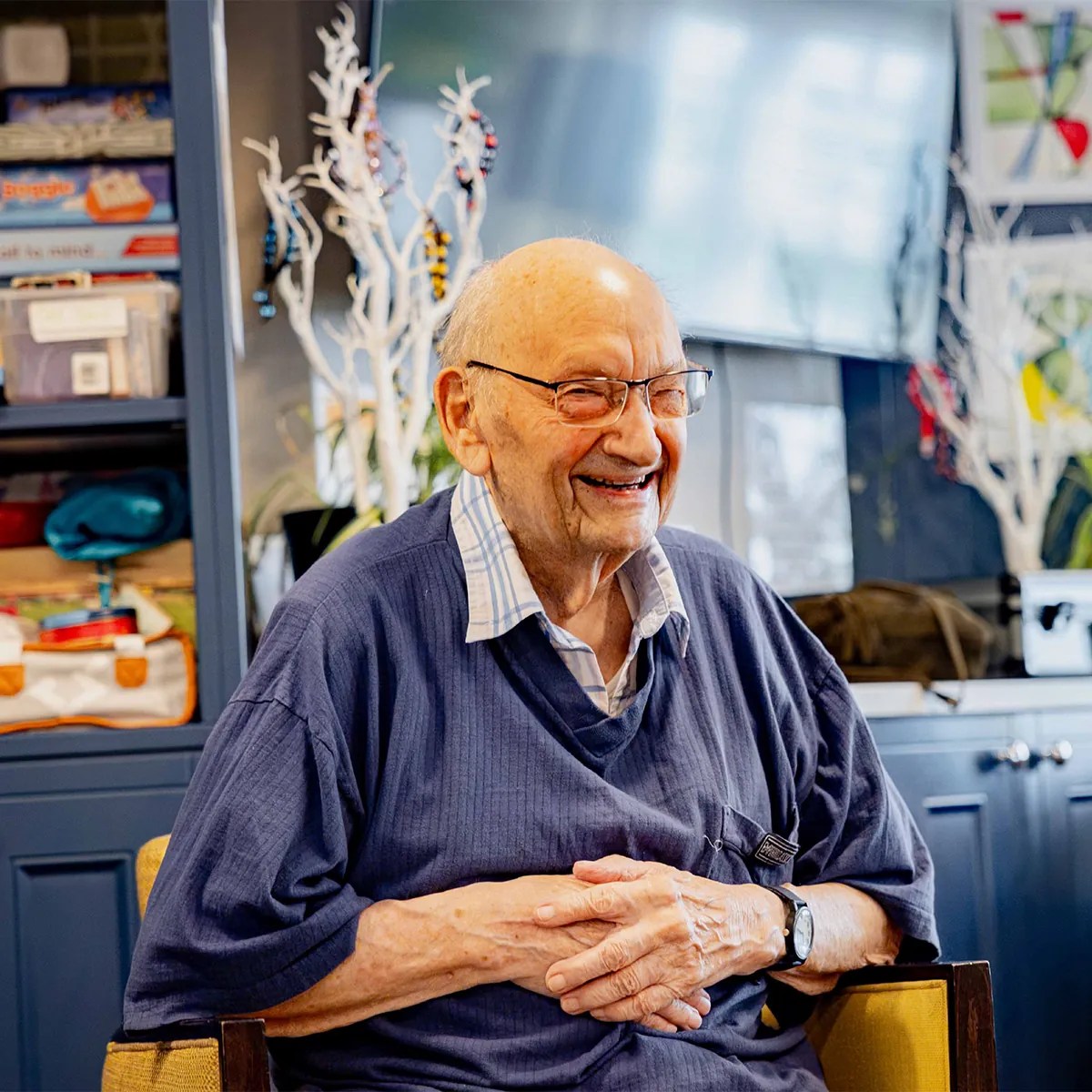 An EverActive trainer leading a seated session with residents