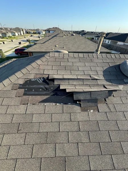 wind-damaged-roof-missing-shingles