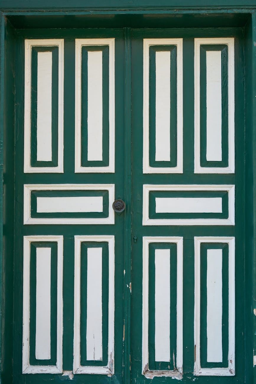 photo of green and white wooden door